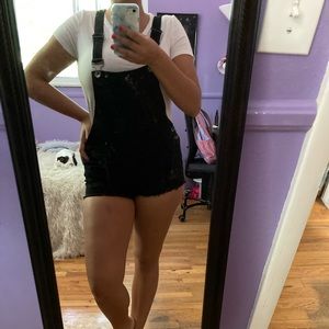 Black shorts overalls.